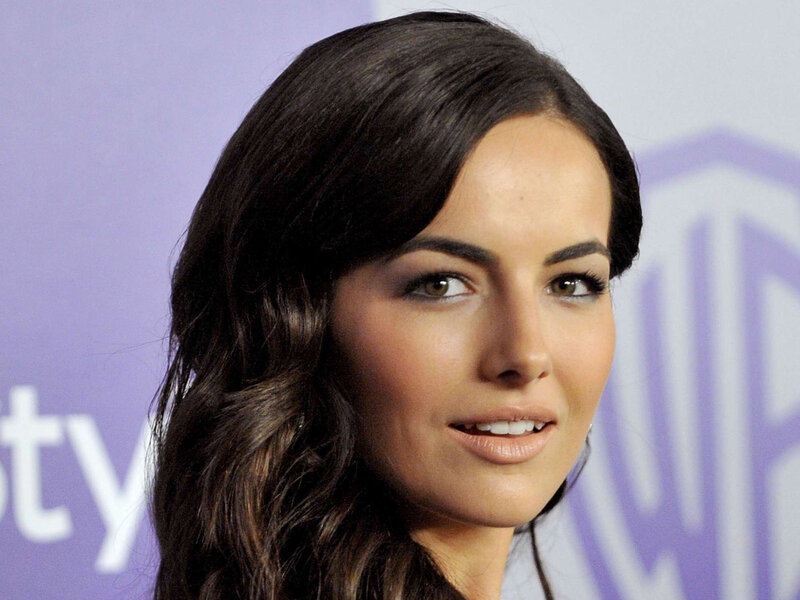 woman with dark hair smiling