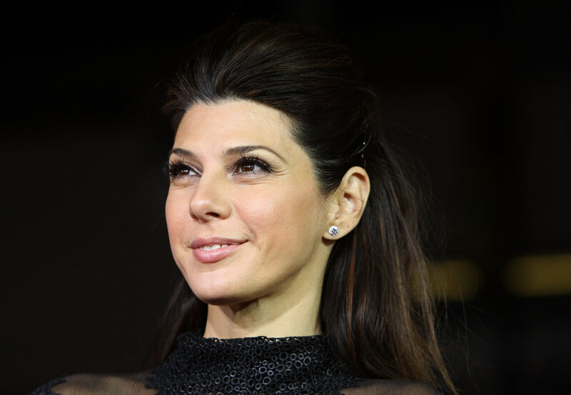 woman with dark hair smiling