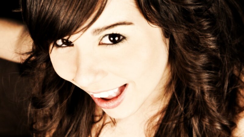 woman with dark hair smiling