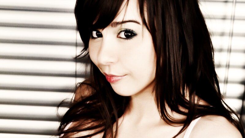woman with dark hair smiling