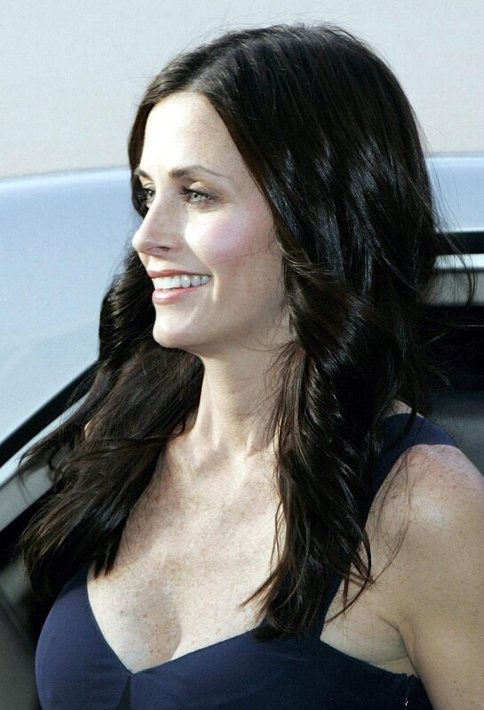 woman with dark hair smiling
