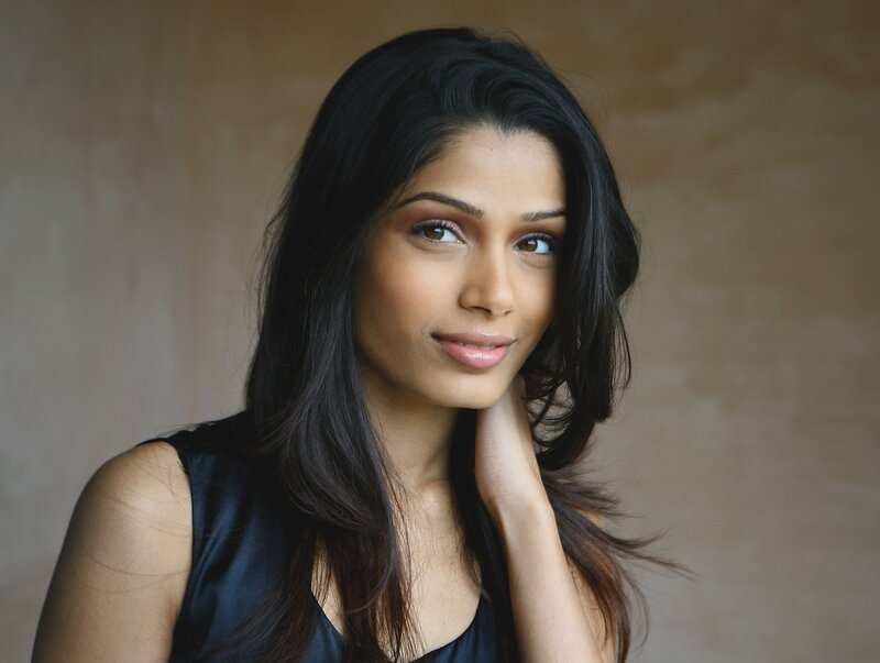 woman with dark hair smiling