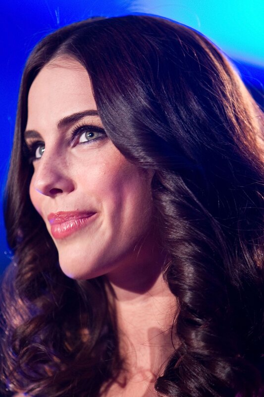 woman with dark hair smiling