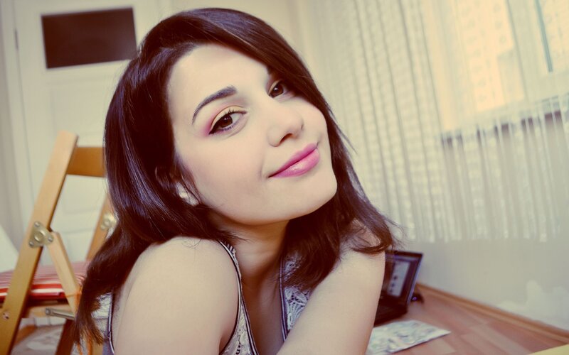 woman with dark hair smiling