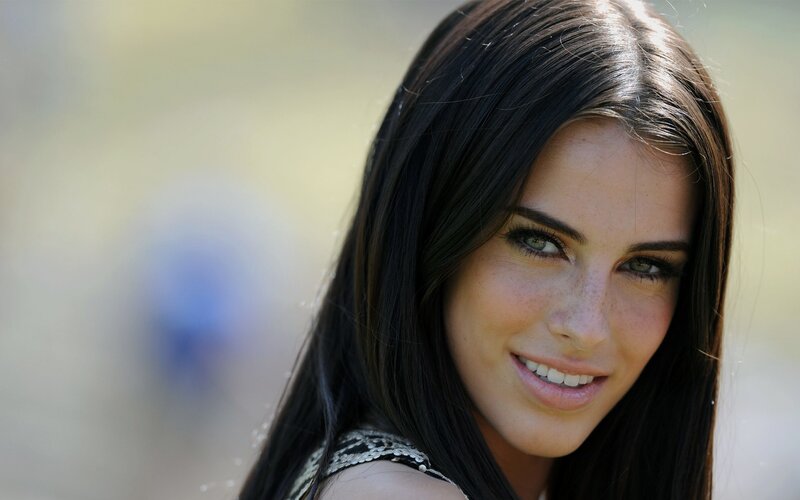 woman with dark hair smiling