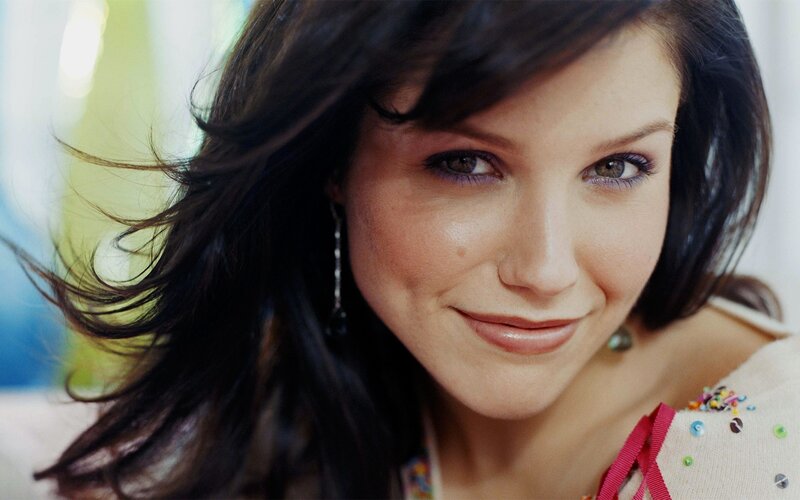 woman with dark hair smiling