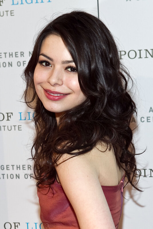 woman with dark hair smiling