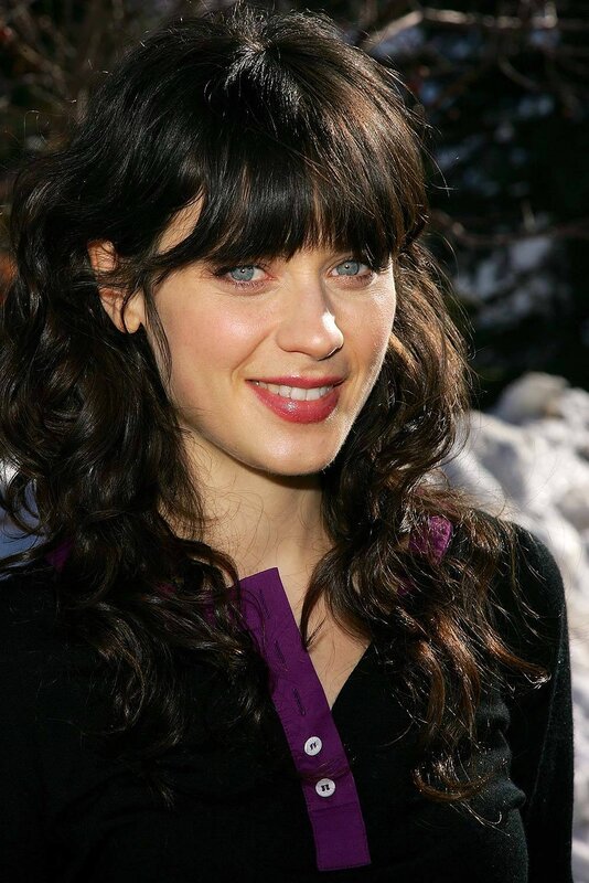 woman with dark hair smiling