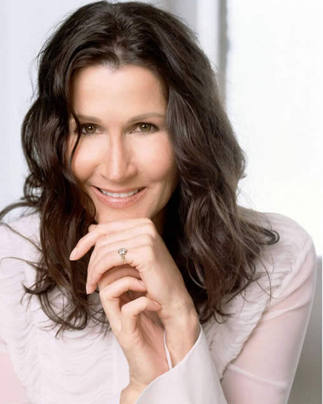 woman with dark hair smiling
