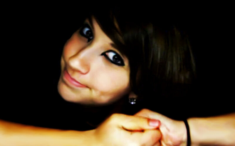 woman with dark hair smiling