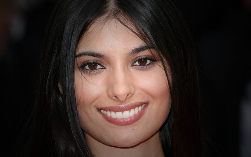 woman with dark hair smiling