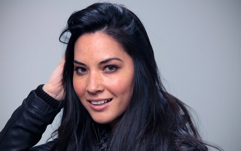 woman with dark hair smiling