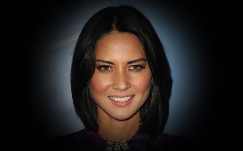 woman with dark hair smiling