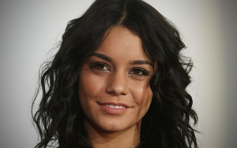woman with dark hair smiling