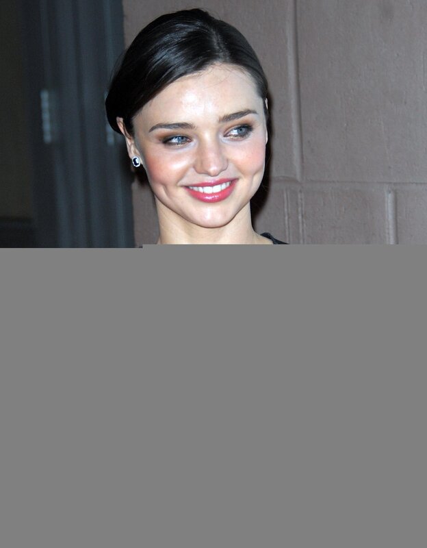 woman with dark hair smiling