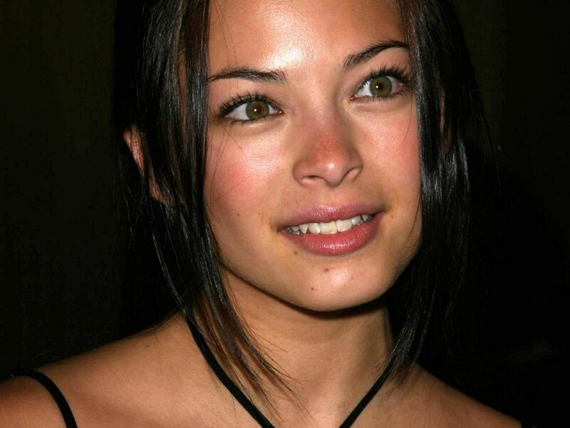 woman with dark hair smiling