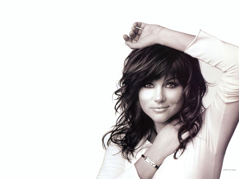 woman with dark hair smiling