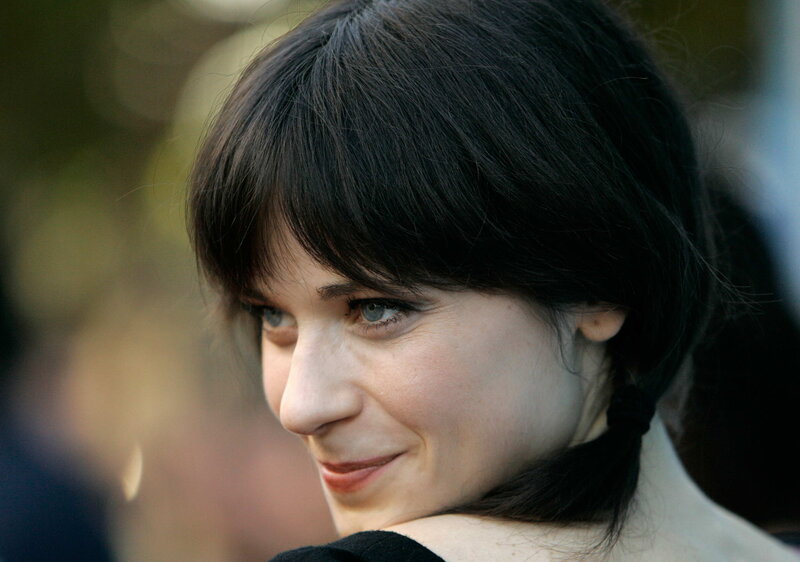 woman with dark hair smiling