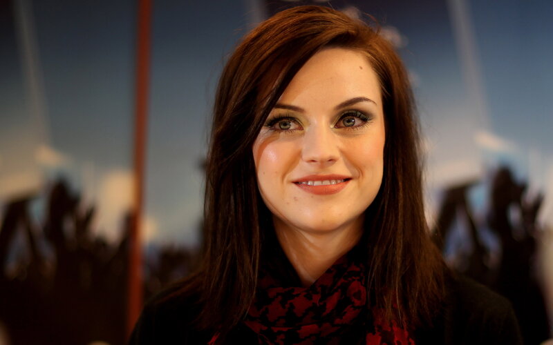 woman with dark hair smiling