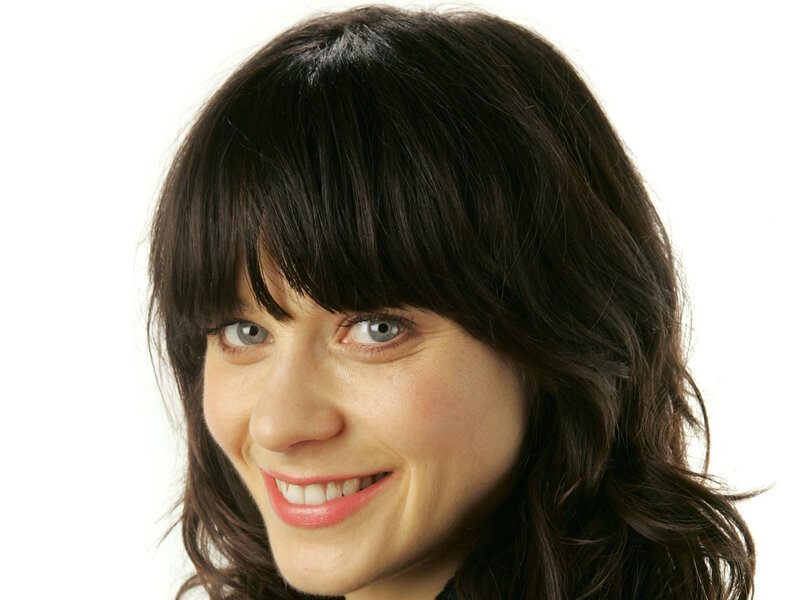 woman with dark hair smiling
