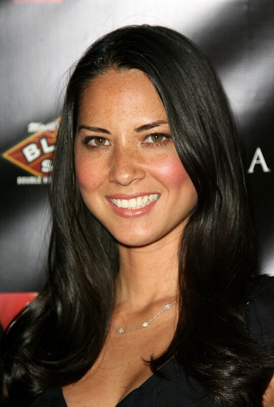 woman with dark hair smiling