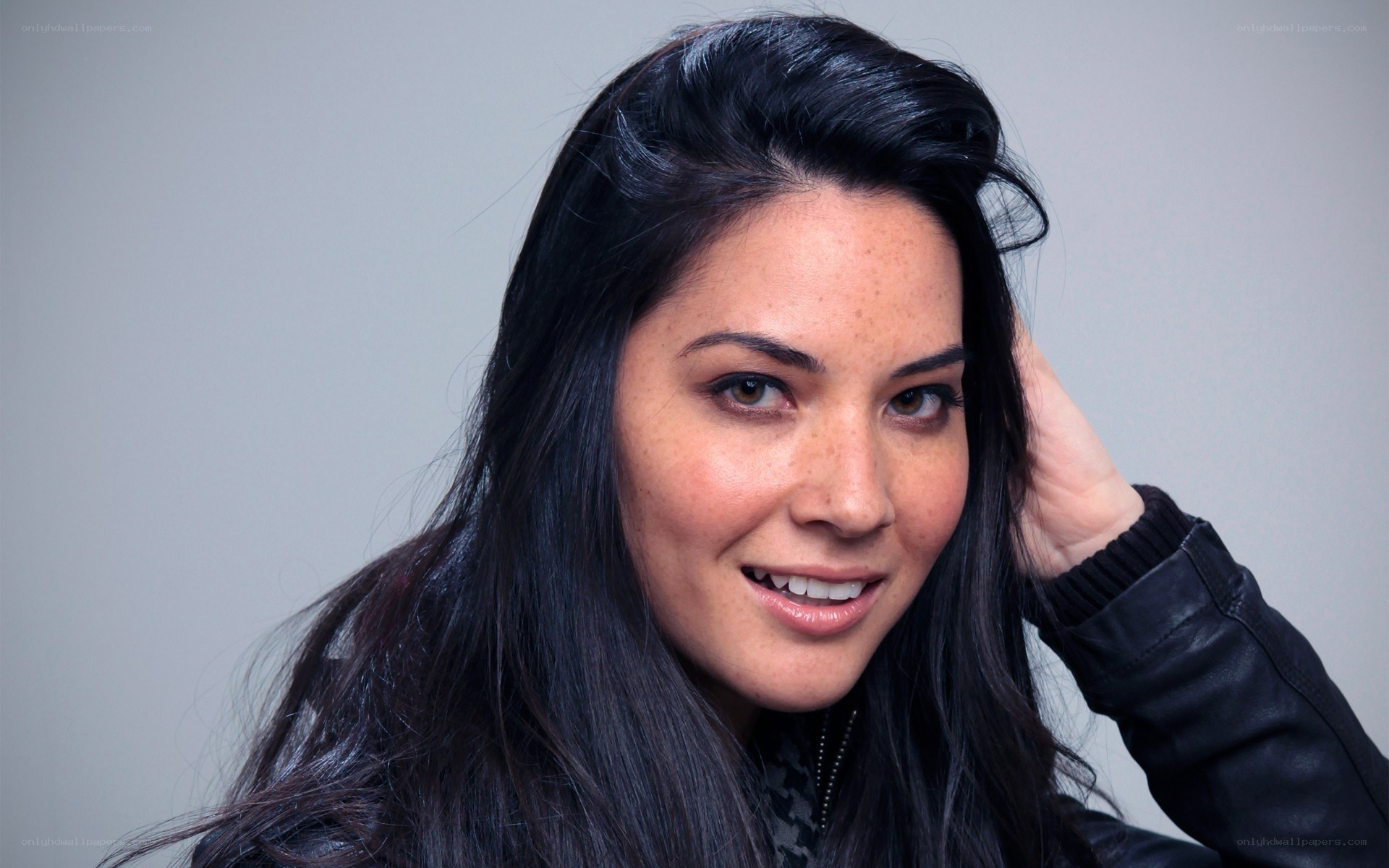 woman with dark hair smiling