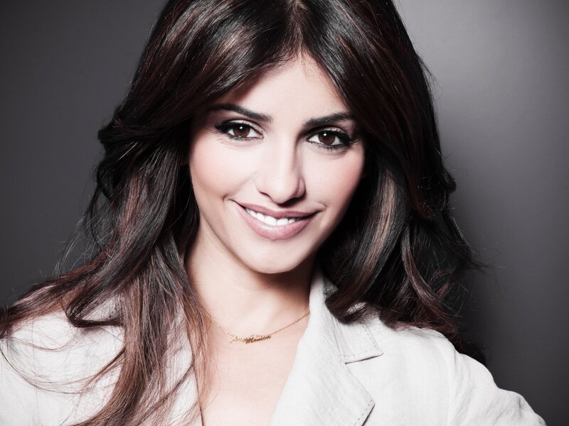 woman with dark hair smiling