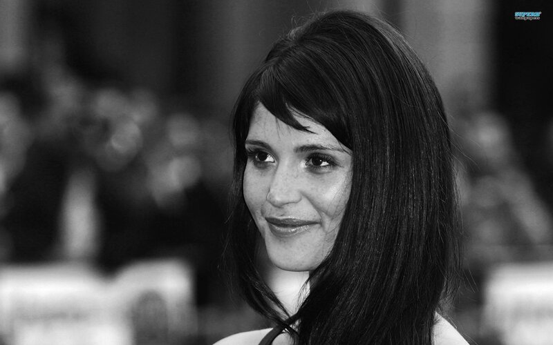 woman with dark hair smiling