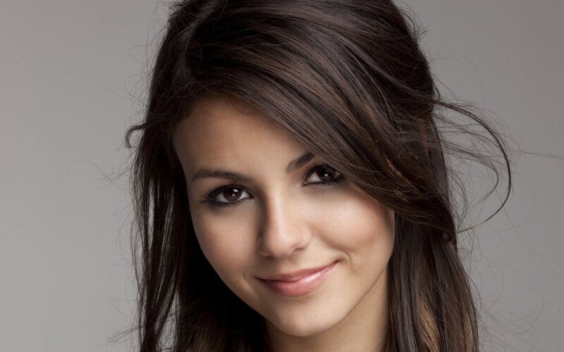 woman with dark hair smiling
