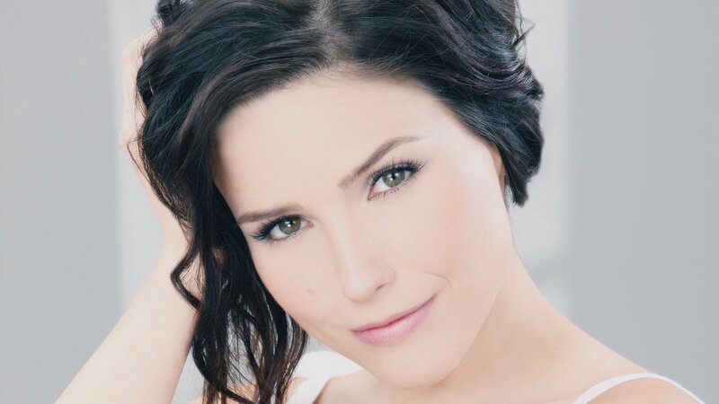 woman with dark hair smiling