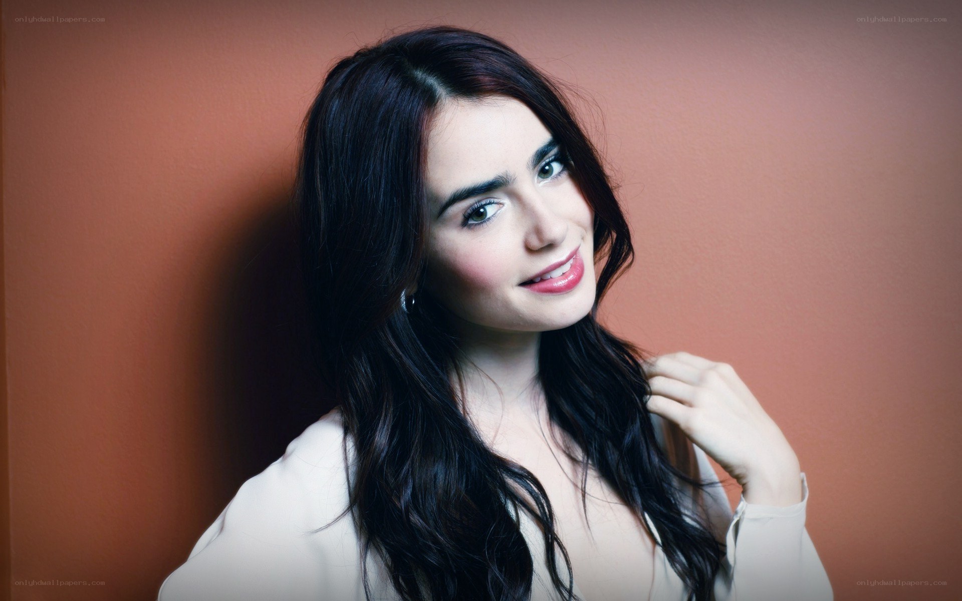 woman with dark hair smiling