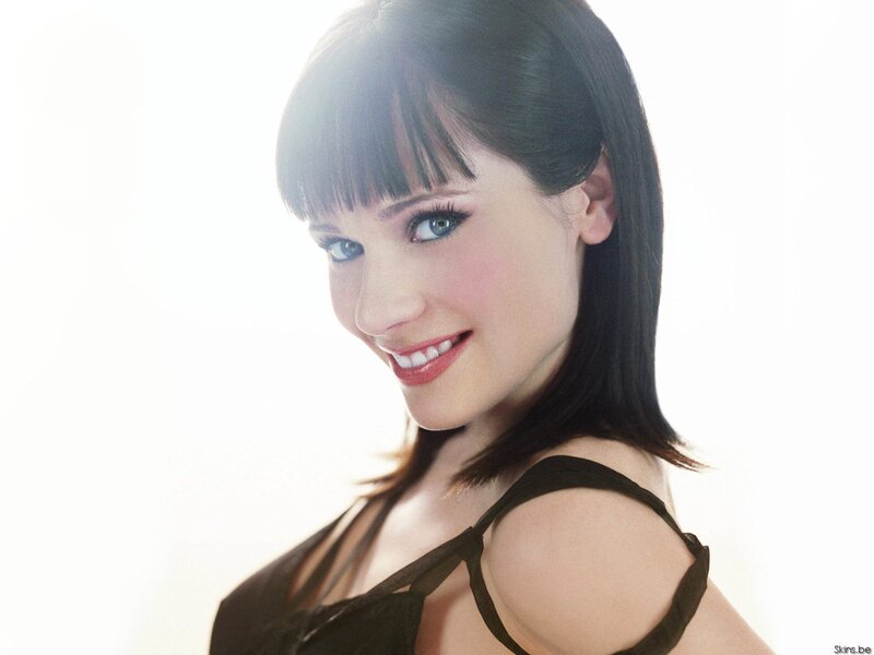 woman with dark hair smiling