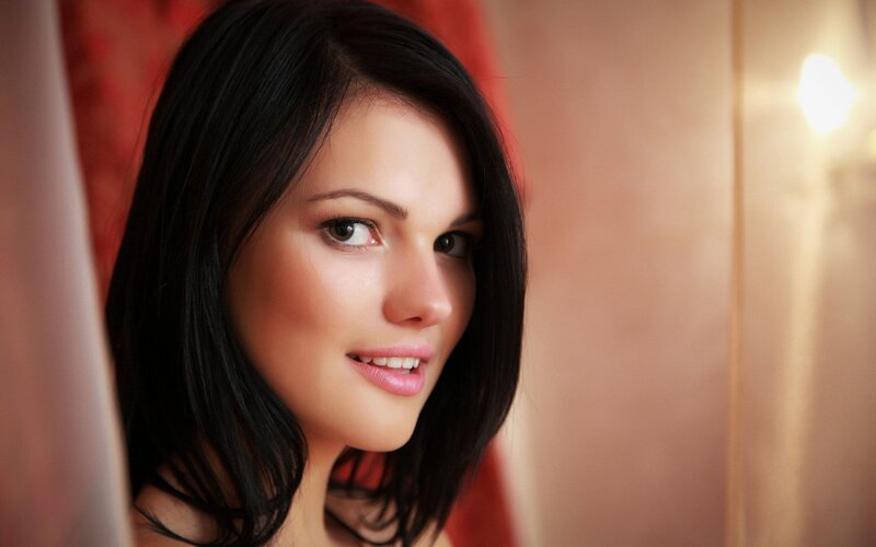 woman with dark hair smiling