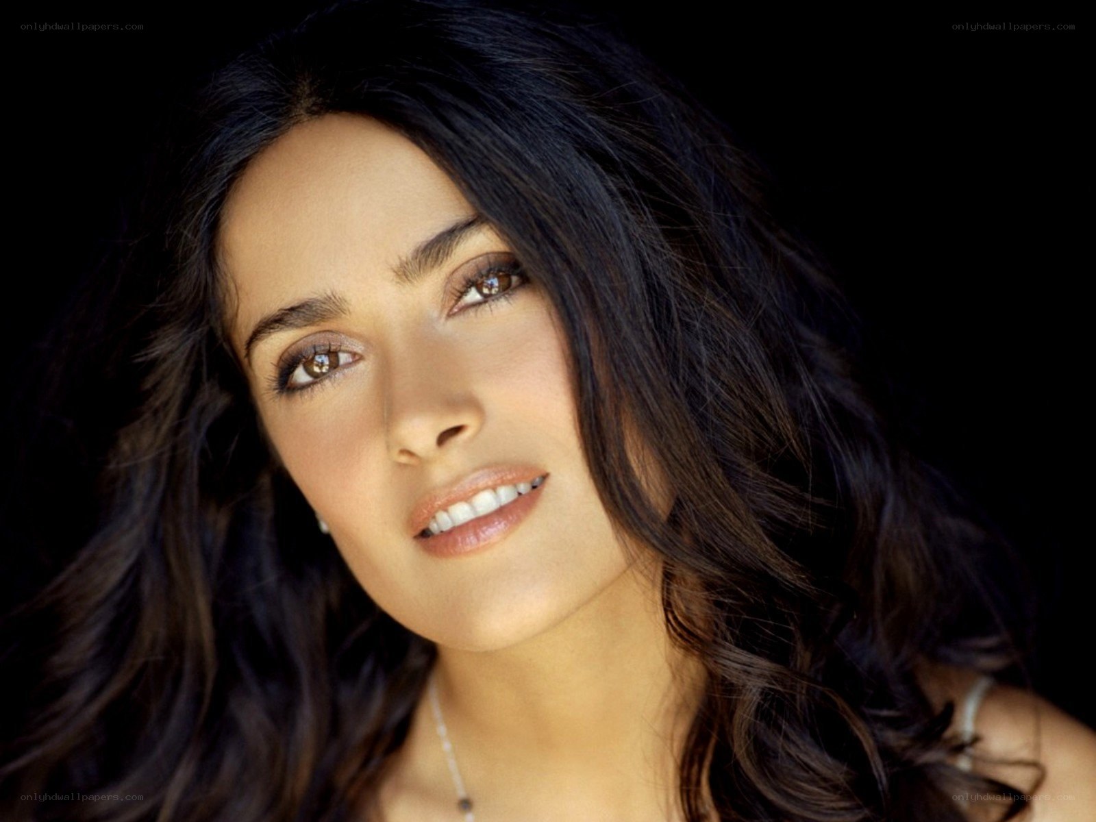 woman with dark hair smiling