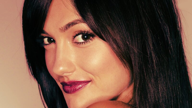 woman with dark hair smiling