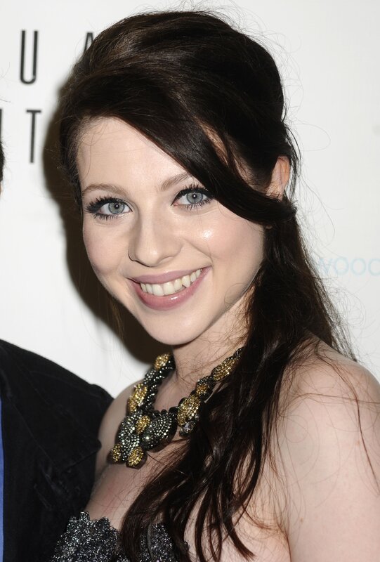 woman with dark hair smiling