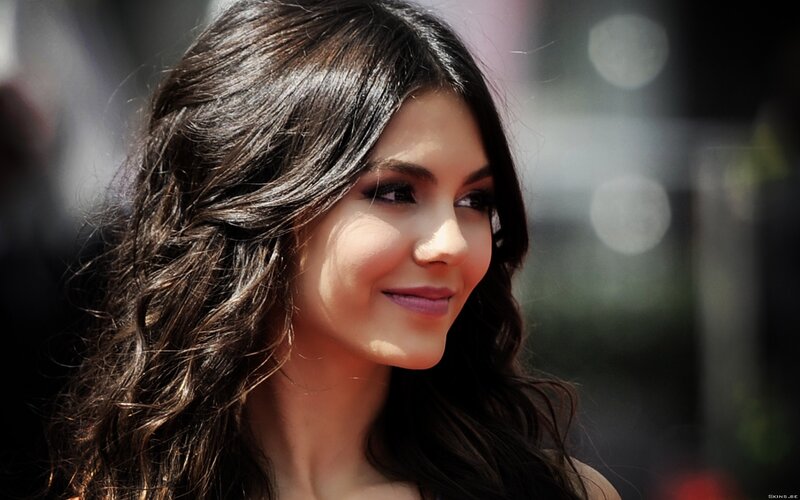 woman with dark hair smiling