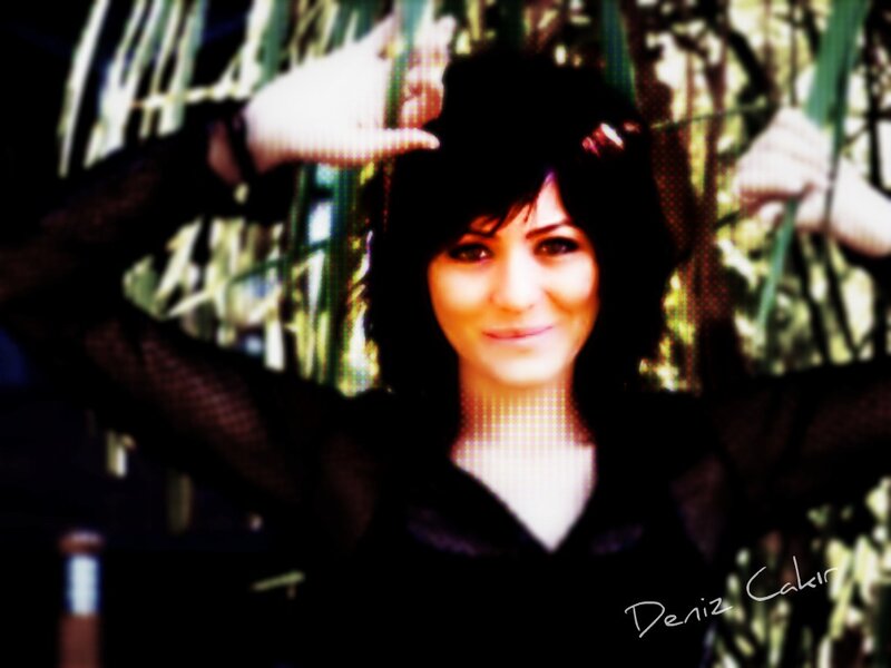 woman with dark hair smiling