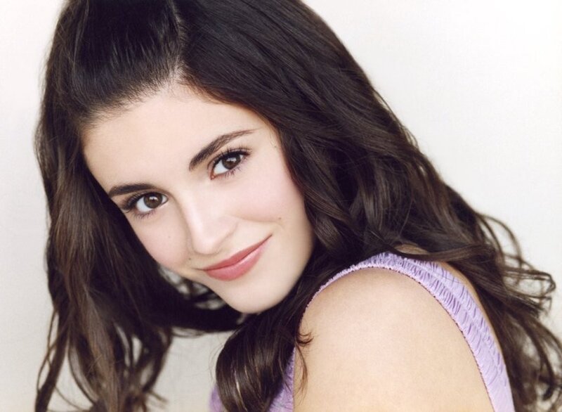 woman with dark hair smiling