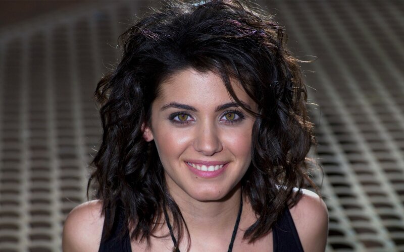 woman with dark hair smiling