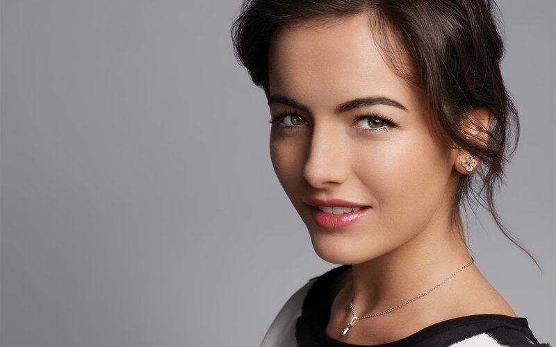 woman with dark hair smiling