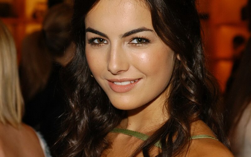 woman with dark hair smiling