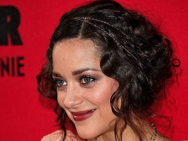 woman with dark hair smiling