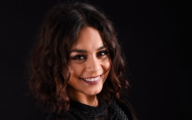 woman with dark hair smiling