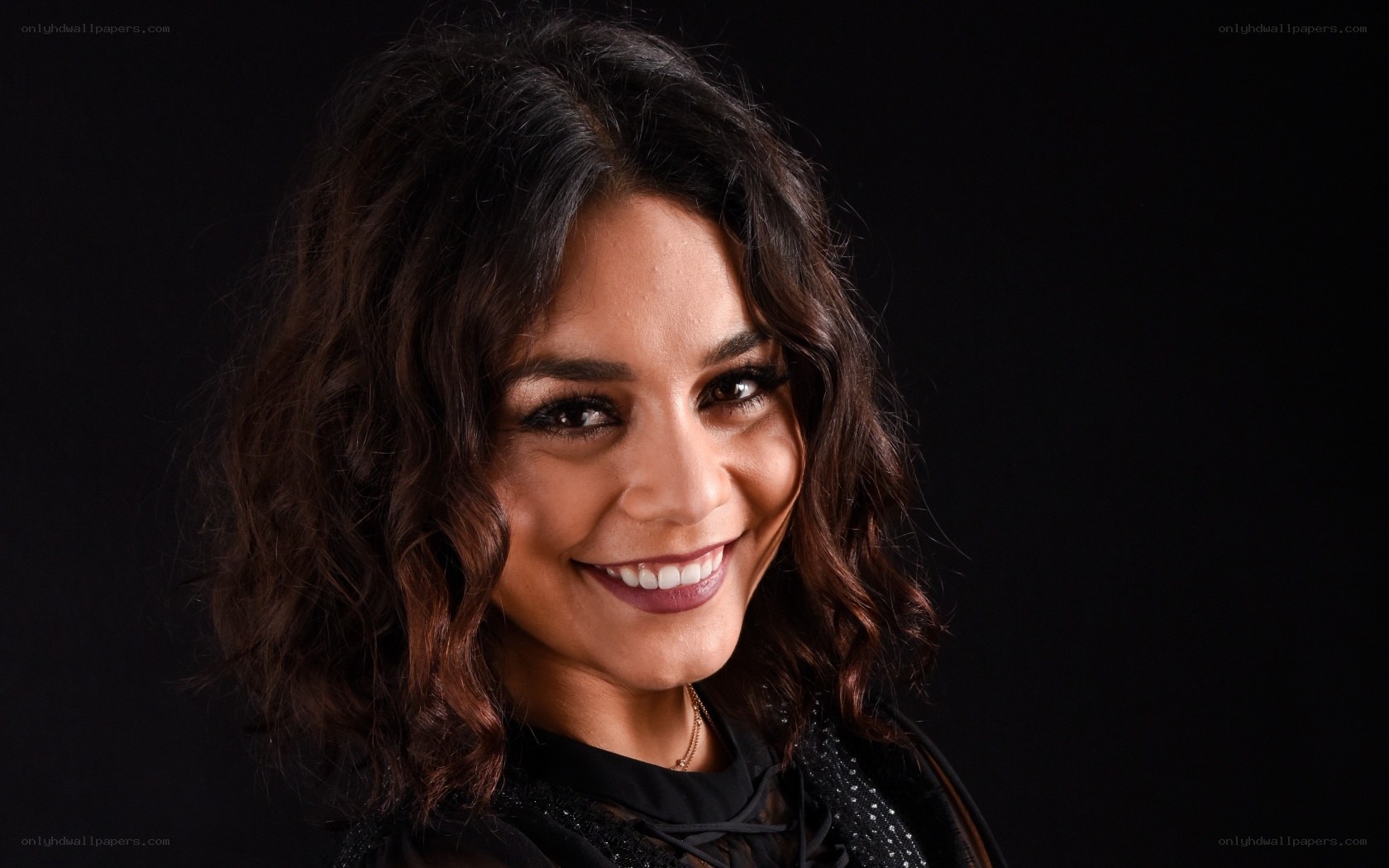 woman with dark hair smiling