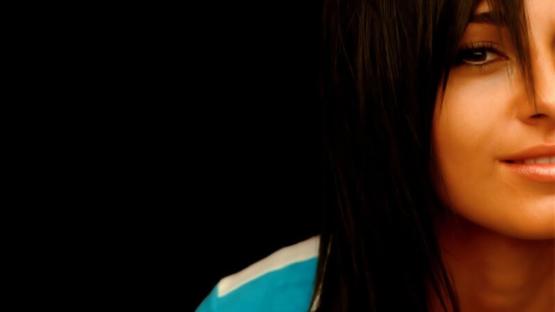 woman with dark hair smiling
