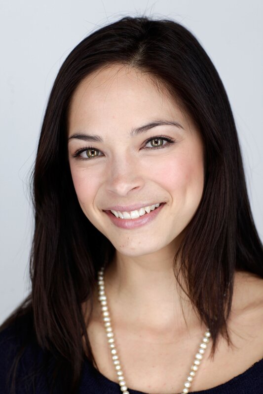 woman with dark hair smiling