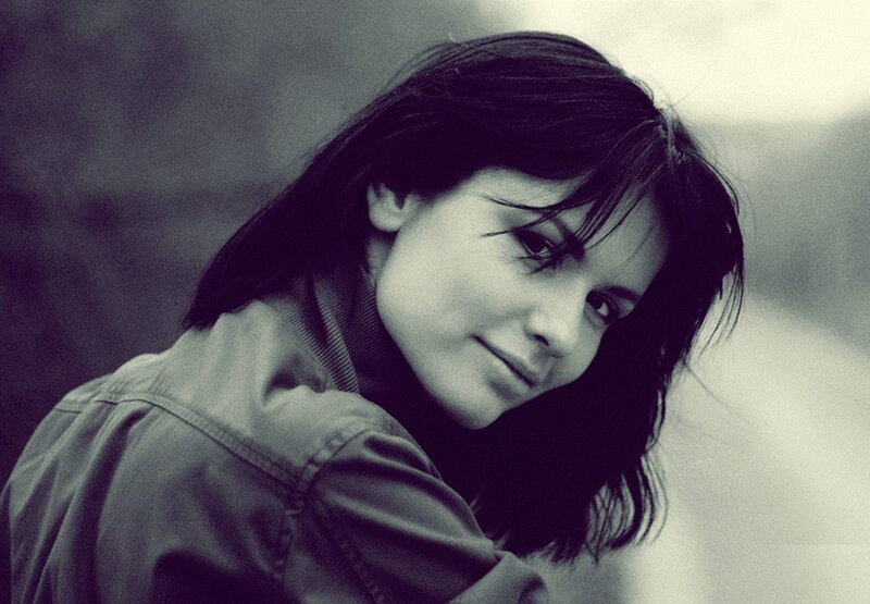 woman with dark hair smiling