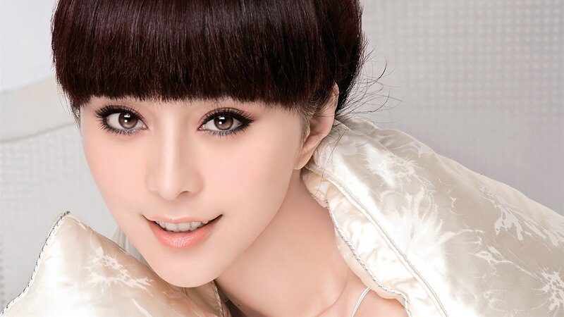 woman with dark hair smiling