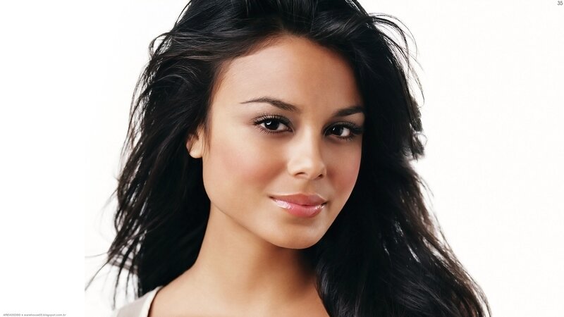 woman with dark hair smiling